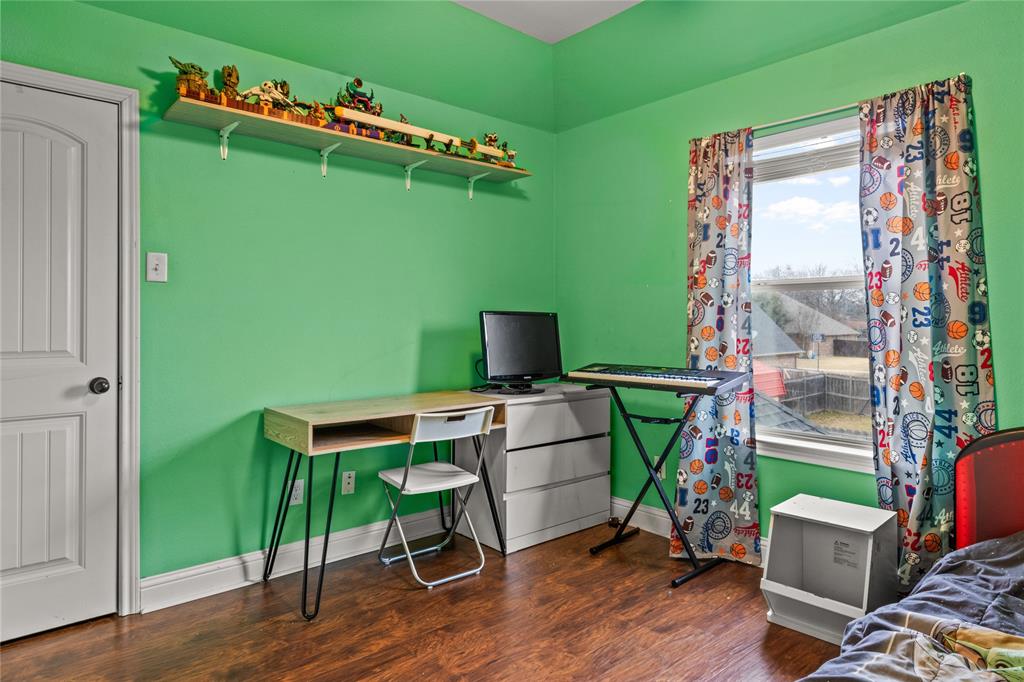 517 Austin Acre Road Sulphur Springs, TX 75482 - Photo 32 of 36 a view of a workspace with furniture and a window