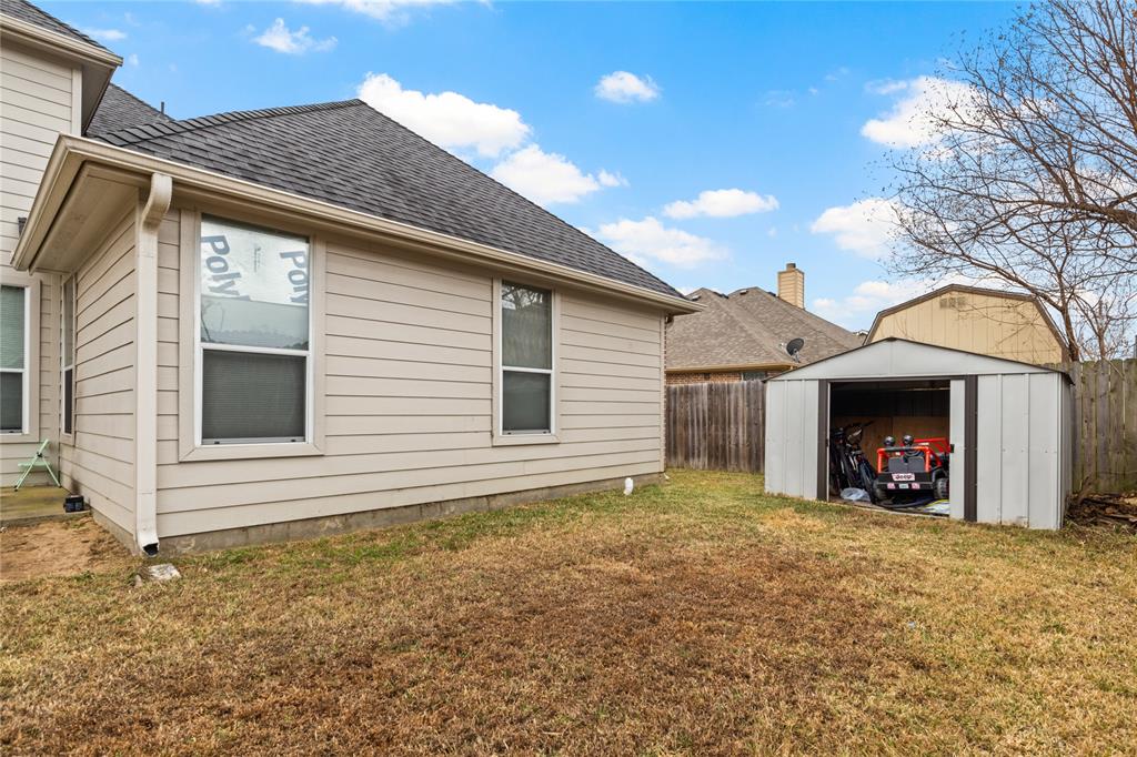 517 Austin Acre Road Sulphur Springs, TX 75482 - Photo 34 of 36 a view of a house with a yard and garage