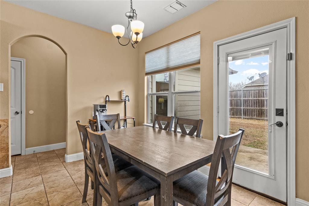 517 Austin Acre Road Sulphur Springs, TX 75482 - Photo 10 of 36 a view of a dining room with furniture window and wooden floor