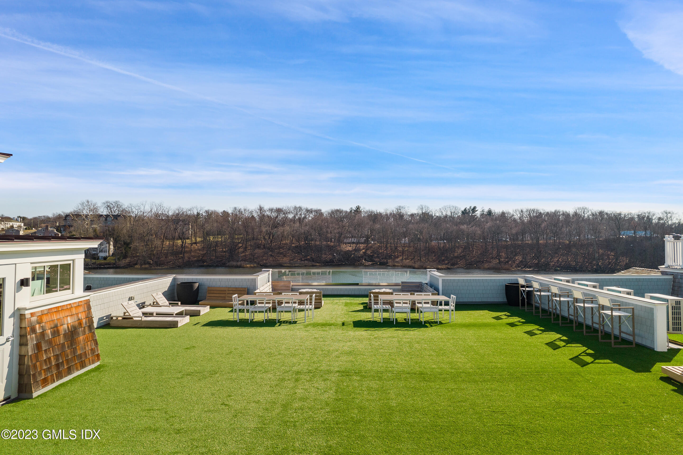 89 River Road, Unit 202 Cos Cob, CT 06807 - Photo 20 of 23 a view of a lake with couches