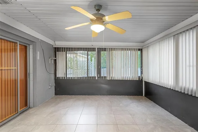 a kitchen with a sink dishwasher stove and white cabinets