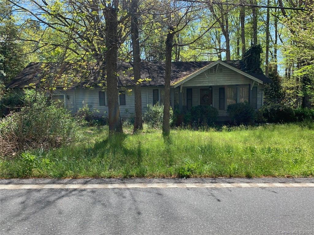 1030 Highway 64 Rutherfordton, NC 28139 - Photo 2 of 16 a front view of a house with yard and green space