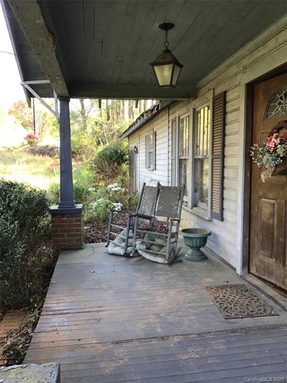 1030 Highway 64 Rutherfordton, NC 28139 - Photo 5 of 16 a backyard of a house with table and chairs