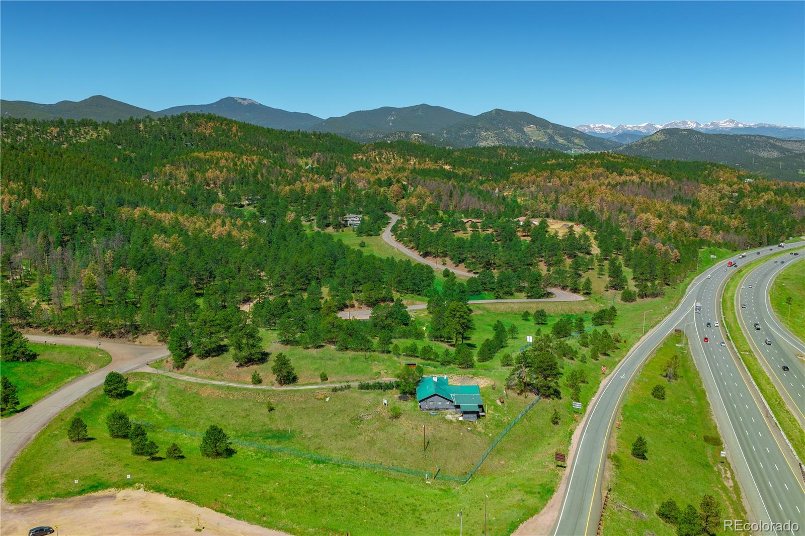 29793 Ruby Ranch Road Evergreen, CO 80439 - Photo 17 of 28 a view of a city with lush green forest