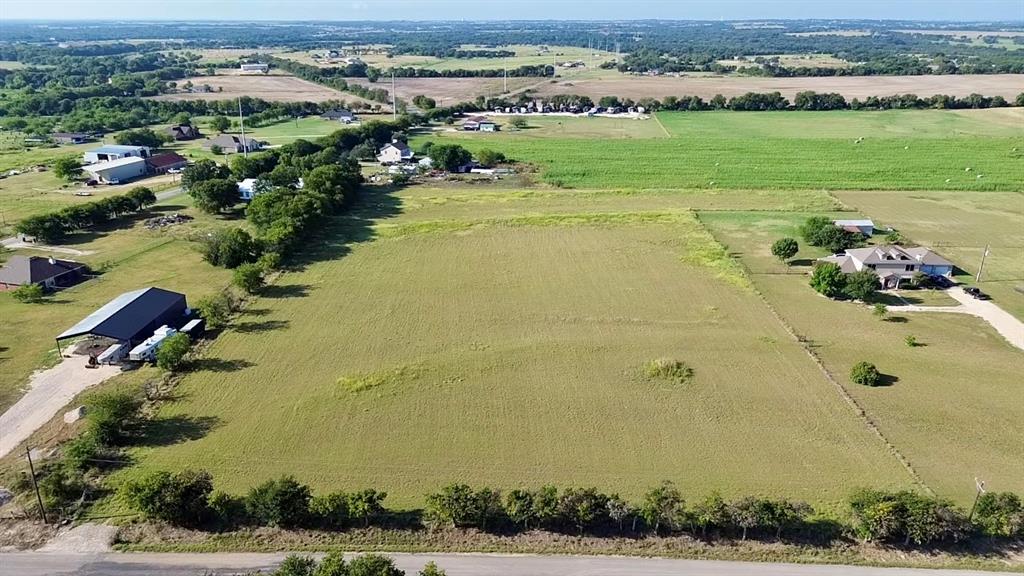 Lot 2-919 West Hillyard Road Troy, TX 76579 - Photo 2 of 9 an aerial view of a houses with outdoor space