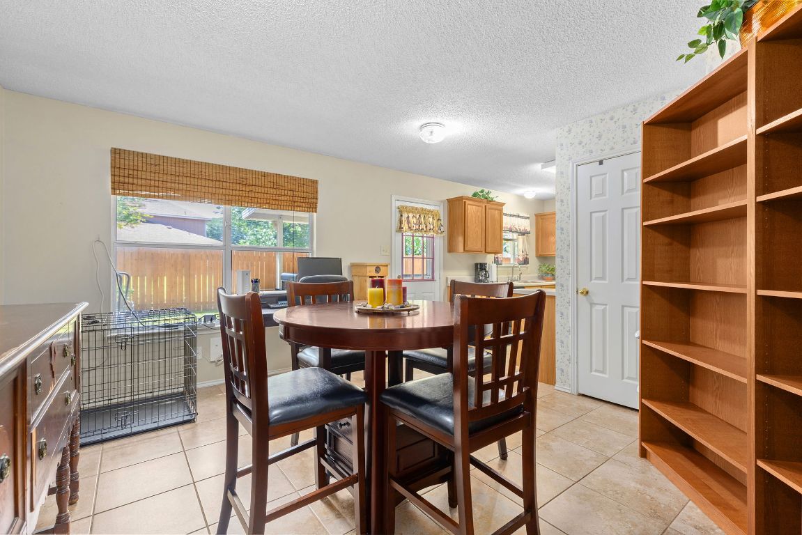 2158 Redwing Way Round Rock, TX 78664 - Photo 12 of 25 a view of a dining room with furniture and a window