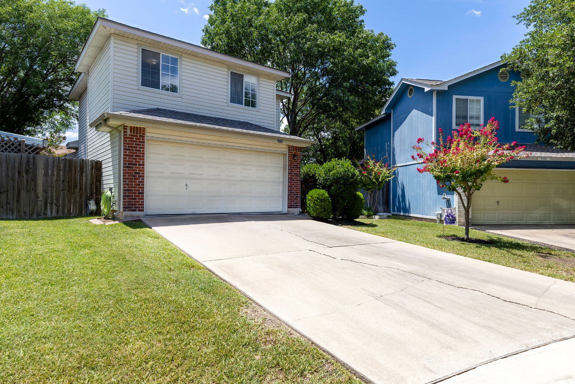 2158 Redwing Way Round Rock, TX 78664 - Photo 2 of 25 a front view of a house with a yard and garage