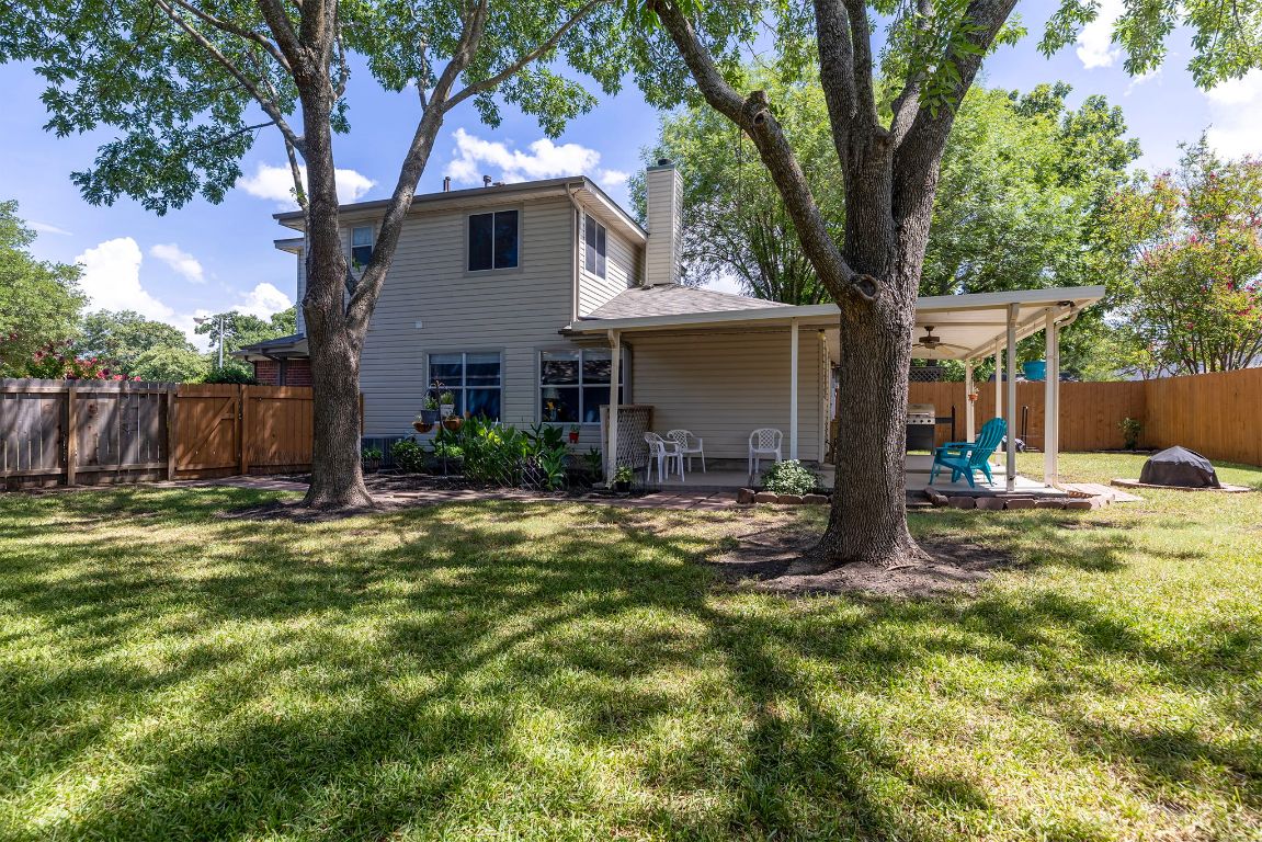 2158 Redwing Way Round Rock, TX 78664 - Photo 24 of 25 a view of a yard in front of a house with large trees