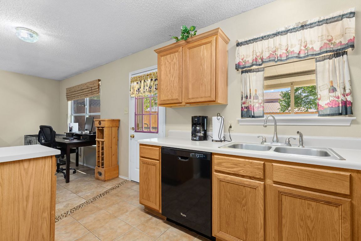 2158 Redwing Way Round Rock, TX 78664 - Photo 10 of 25 a kitchen with a sink cabinets and window