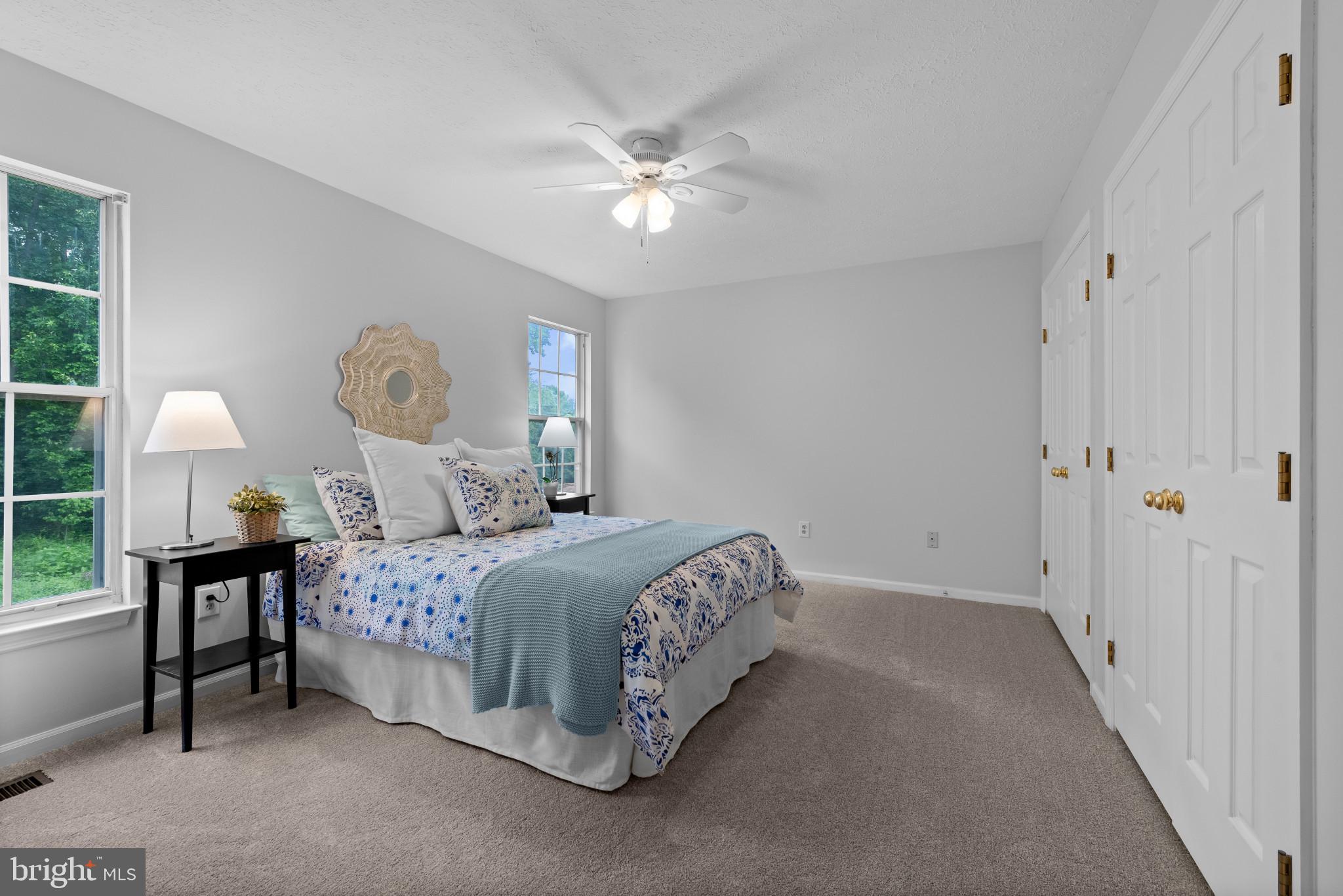 3107 Pouska Road Abingdon, MD 21009 - Photo 22 of 38 a bedroom with a bed and a chandelier