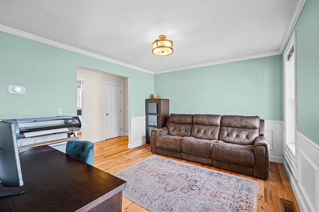 10 Caitlin Road Salisbury, MA 01952 - Photo 14 of 33 a living room with furniture and a rug
