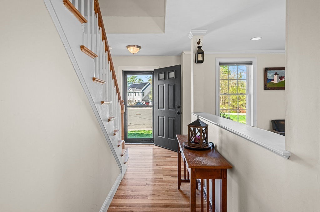 10 Caitlin Road Salisbury, MA 01952 - Photo 16 of 33 a hallway with a window and wooden floor