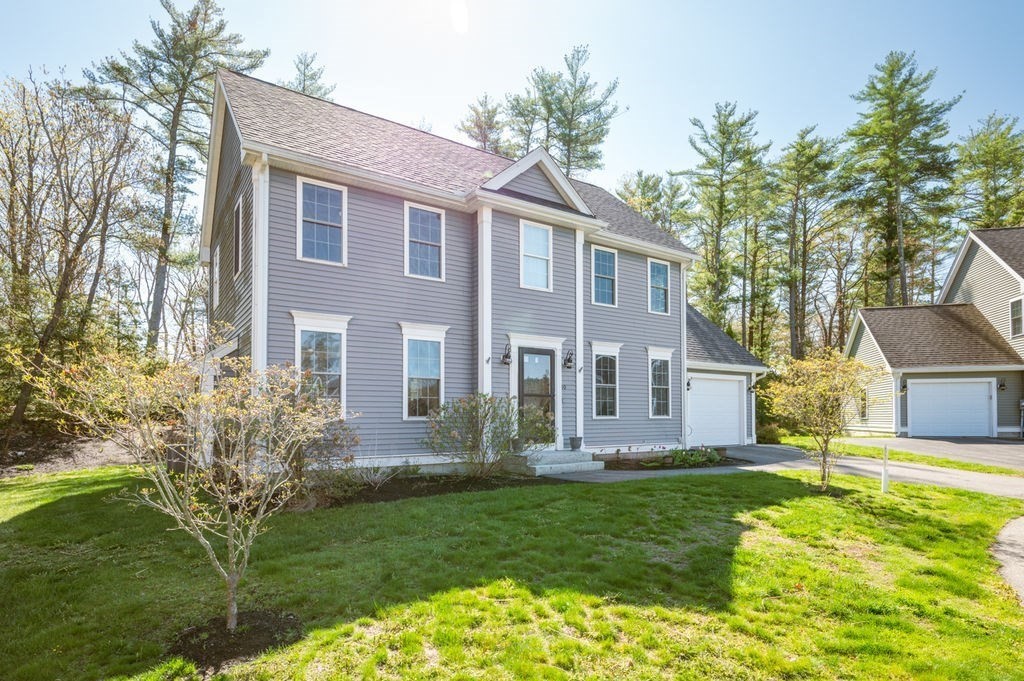 10 Caitlin Road Salisbury, MA 01952 - Photo 2 of 33 a front view of house with yard and green space
