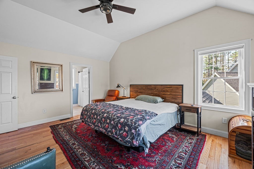 10 Caitlin Road Salisbury, MA 01952 - Photo 21 of 33 a bedroom with a bed a dresser next to a window
