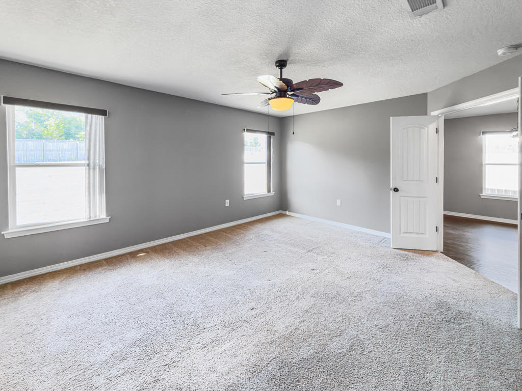 125 Lillian Way Crestview, FL 32536 - Photo 12 of 33 a view of an empty room with a window