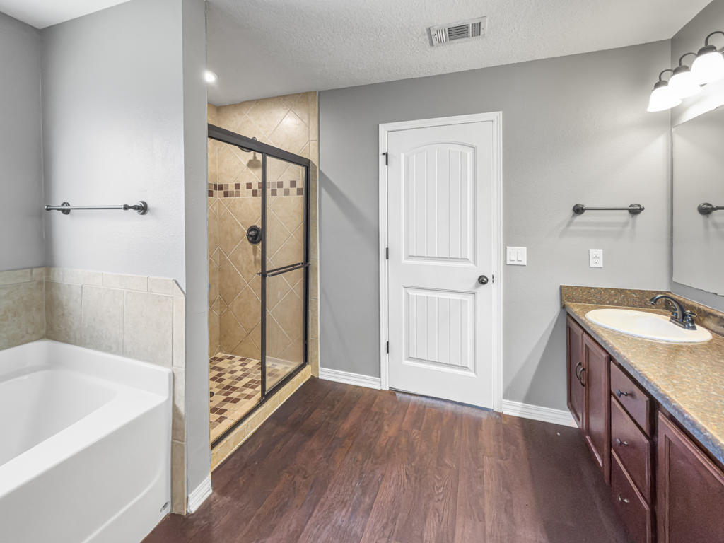 125 Lillian Way Crestview, FL 32536 - Photo 13 of 33 a bathroom with a sink a mirror and a bath tub