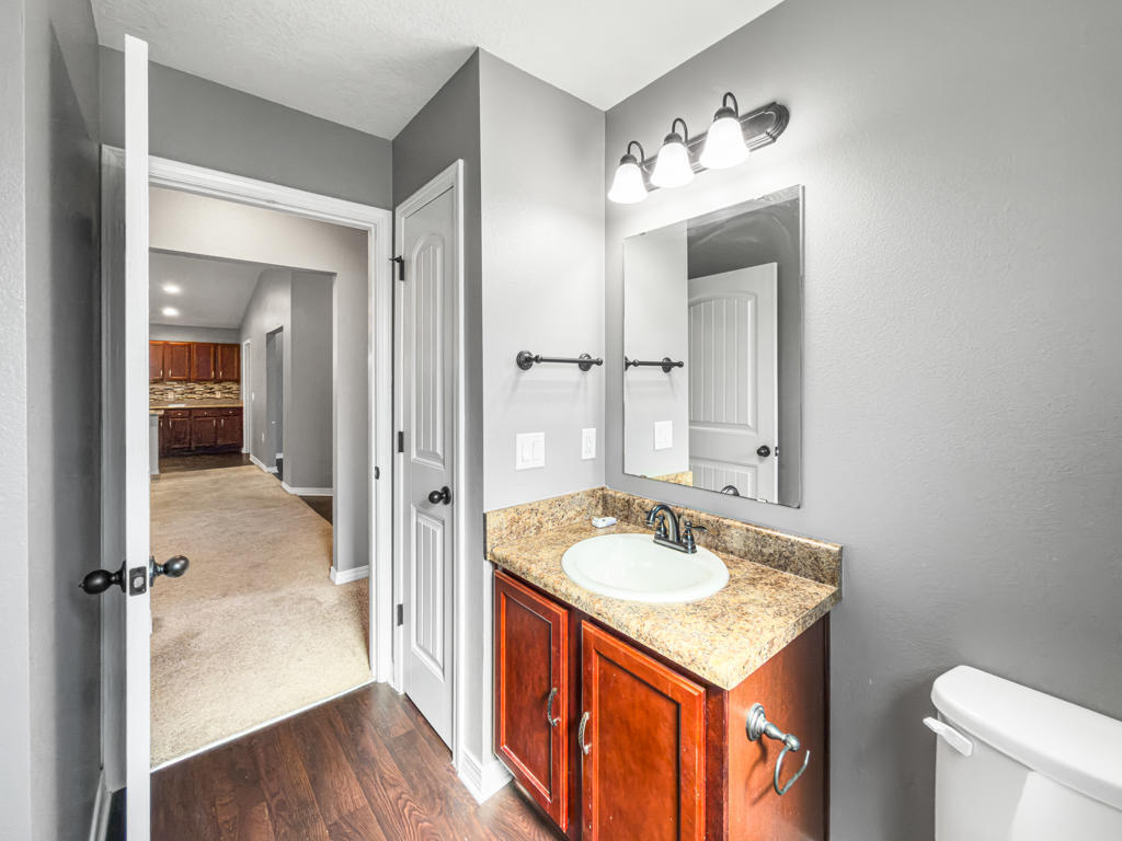 125 Lillian Way Crestview, FL 32536 - Photo 18 of 33 a bathroom with a sink a light fixture and a mirror