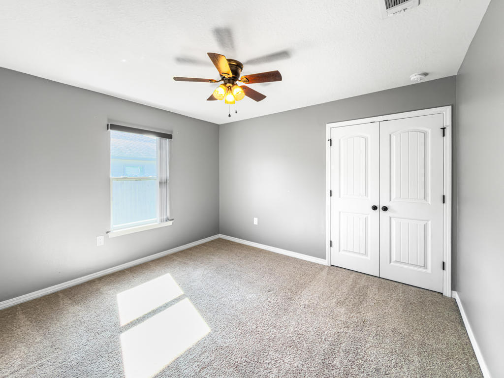125 Lillian Way Crestview, FL 32536 - Photo 19 of 33 a view of an empty room with a window