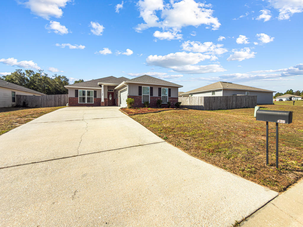 125 Lillian Way Crestview, FL 32536 - Photo 2 of 33 a view of a house with a snow in the yard