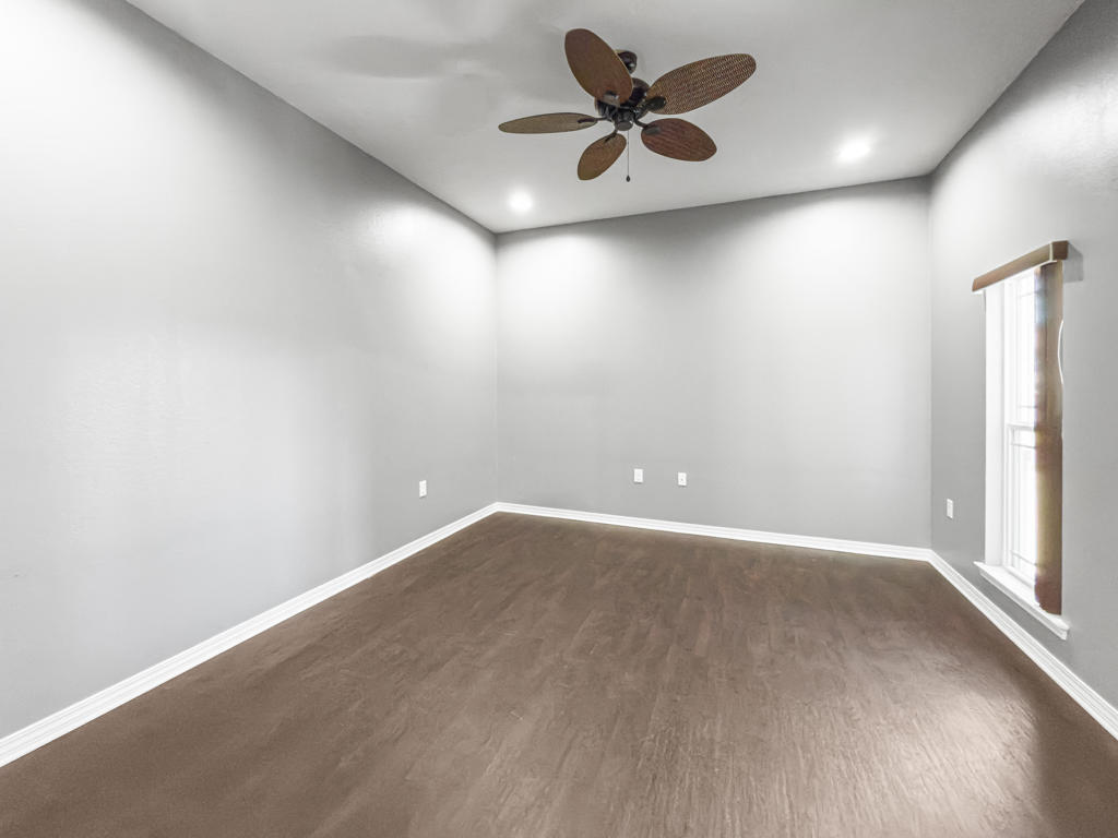 125 Lillian Way Crestview, FL 32536 - Photo 21 of 33 an empty room with a window and a fan