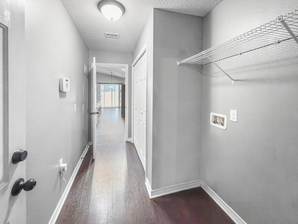 125 Lillian Way Crestview, FL 32536 - Photo 24 of 33 a view of a hallway with wooden floor and closet