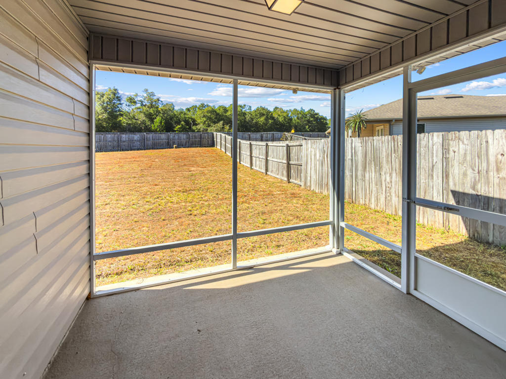 125 Lillian Way Crestview, FL 32536 - Photo 25 of 33 a view of an empty room and window with an outdoor space