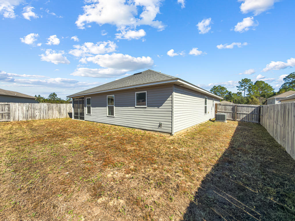 125 Lillian Way Crestview, FL 32536 - Photo 28 of 33 a house view with swimming pool and sitting space