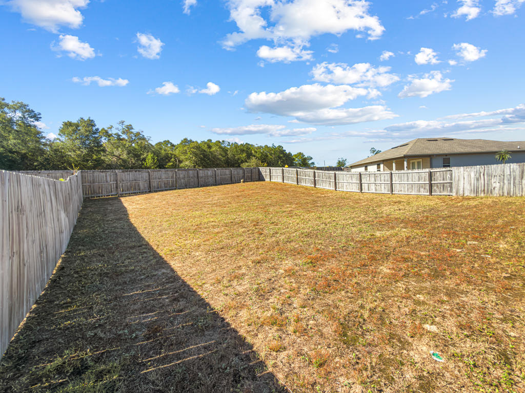 125 Lillian Way Crestview, FL 32536 - Photo 29 of 33 swimming pool with an outdoor seating