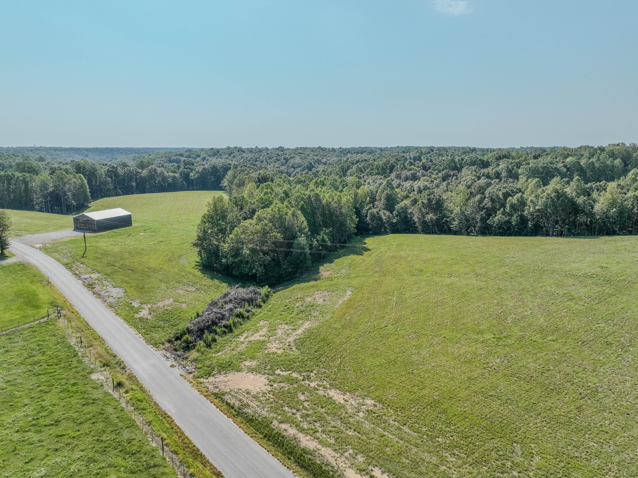 373 Mayfield Road Pulaski, TN 38478 - Photo 17 of 17 a view of a field with an ocean view