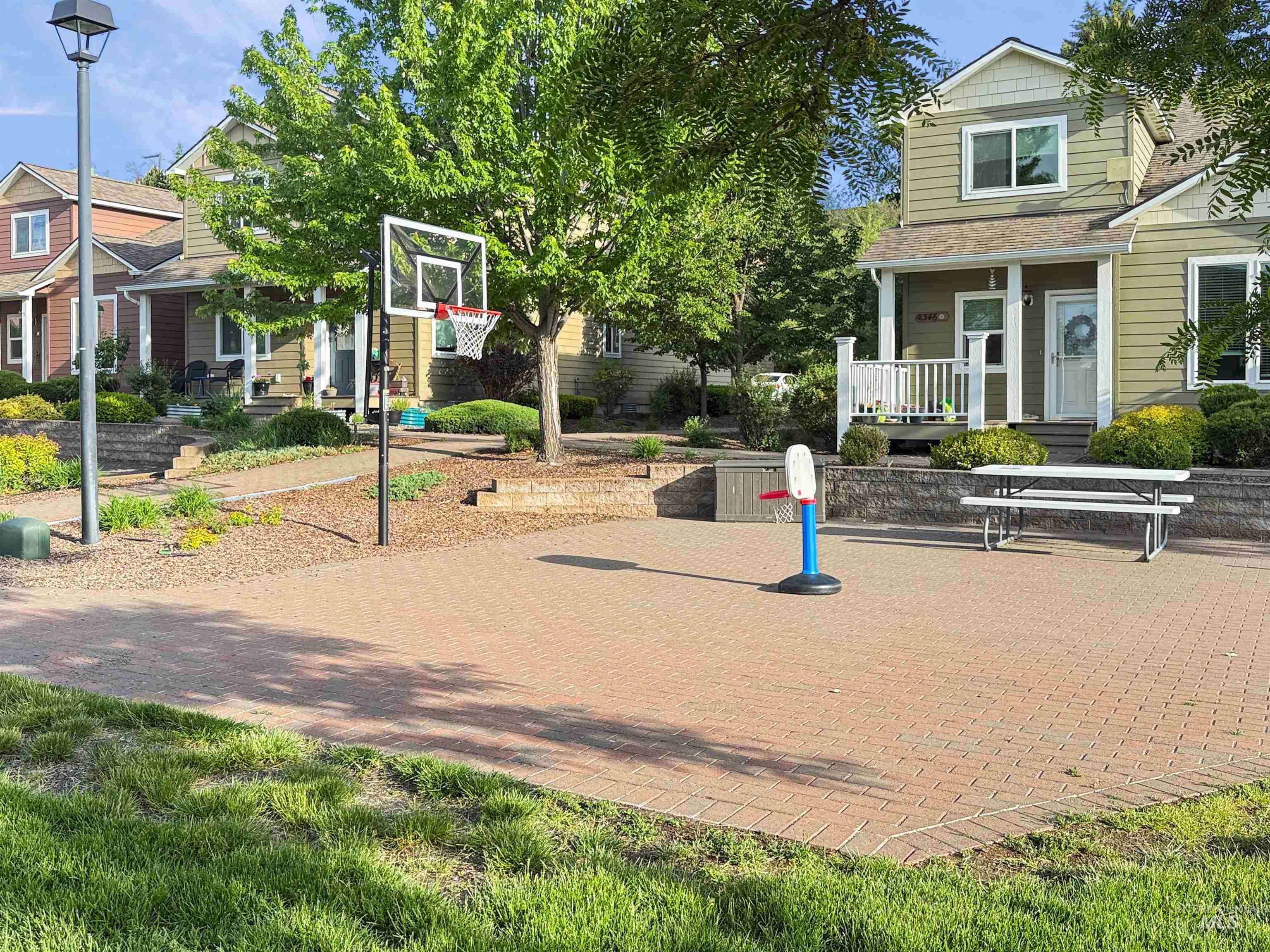 1354 Bristol Road Moscow, ID 83843 - Photo 19 of 19 Expansive paver patio with a basketball hoop and a picnic table