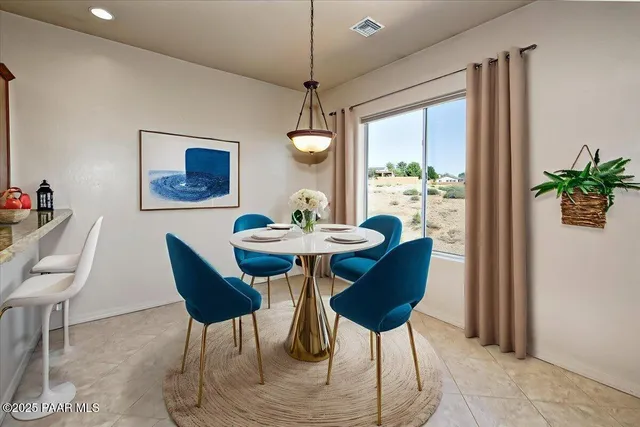 a bedroom with bed and a potted plant