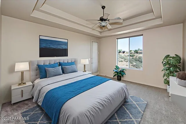 a bedroom with a bed and a potted plant