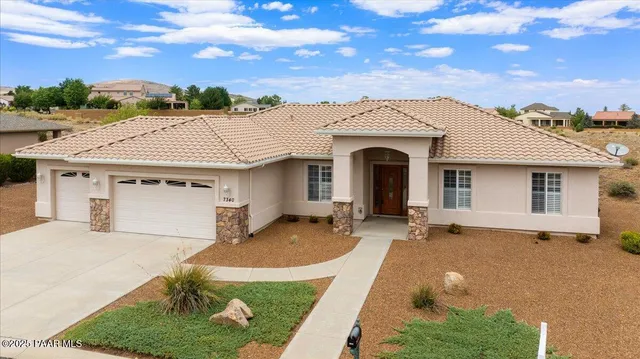 a front view of a house with yard
