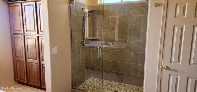 a bathroom with a sink a light fixture and a toilet