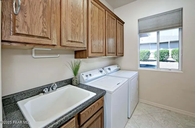 an aerial view of a houses with a yard