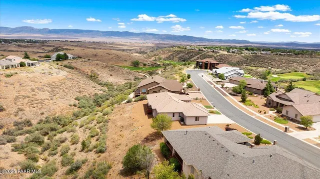 a view of a golf course with a swimming pool