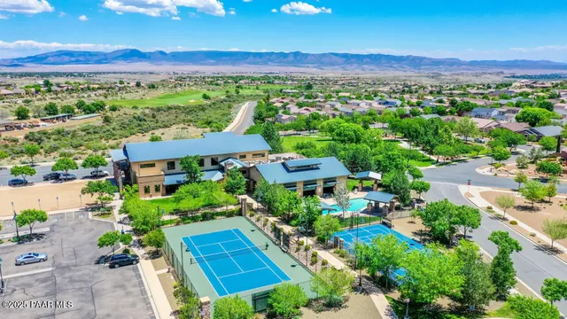 a view of a grassy area with an ocean view