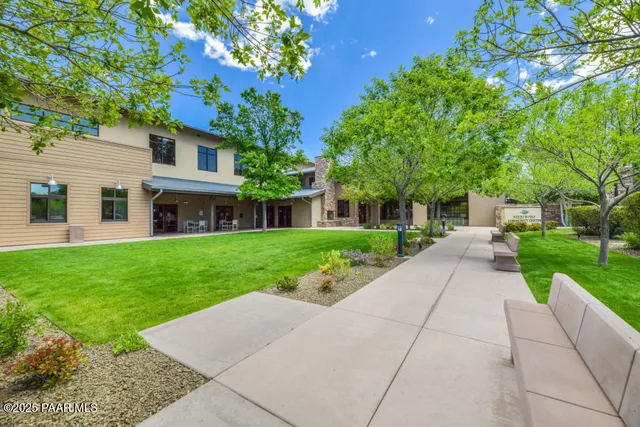 a view of a grassy area with an trees