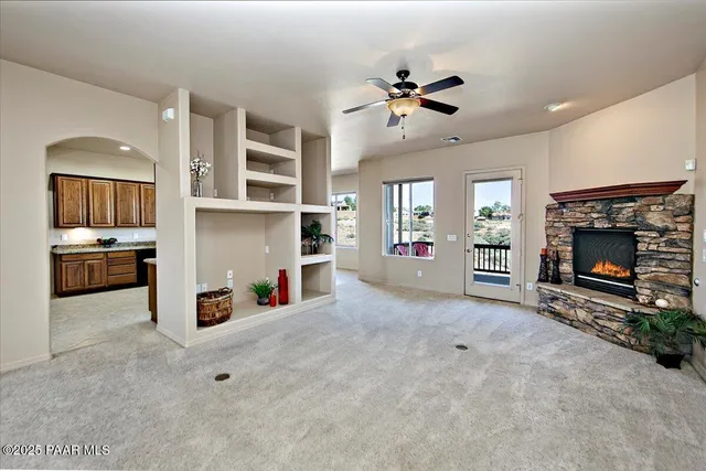 a view of an empty room with a fireplace