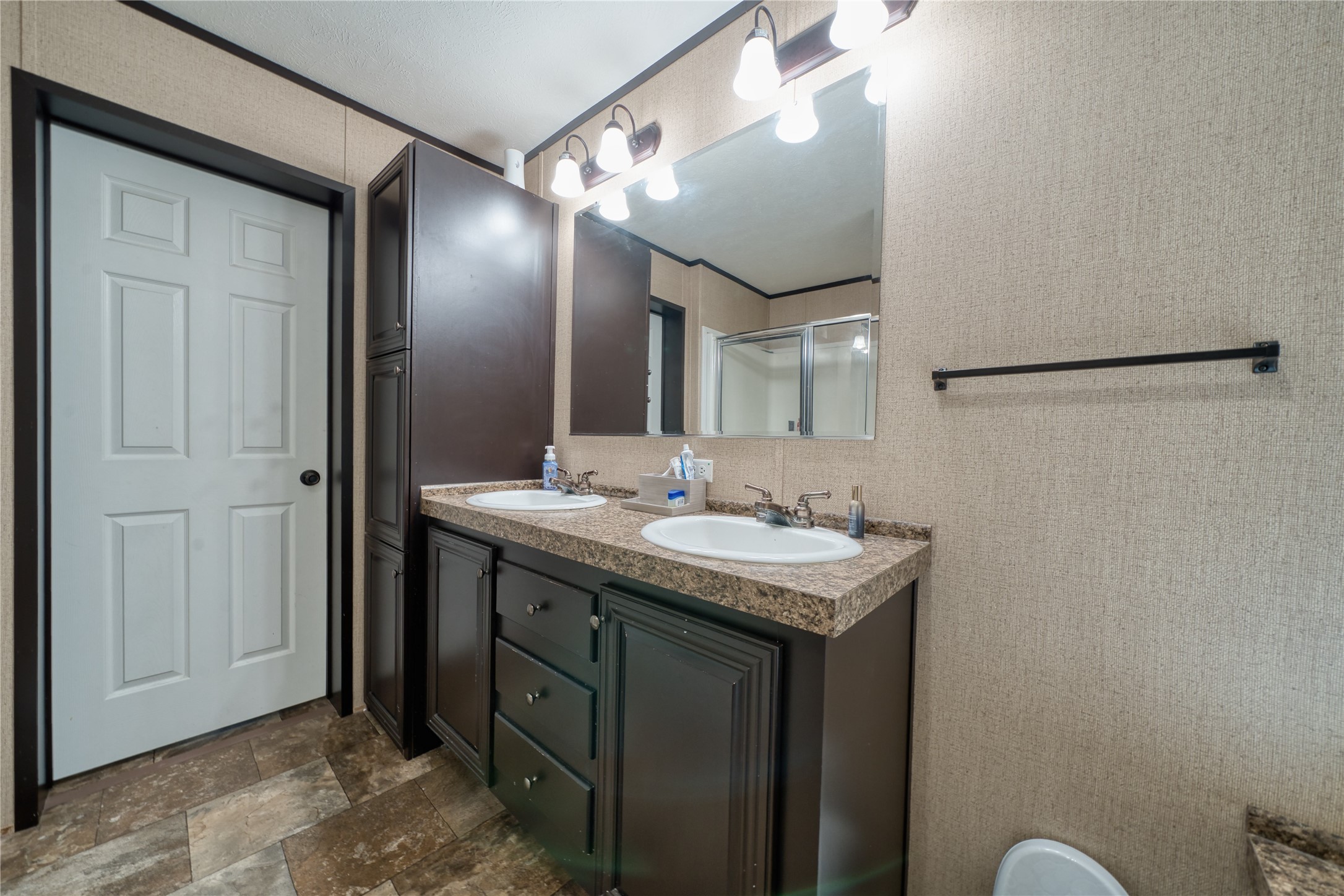 103 County Road 370 Splendora, TX 77372 - Photo 22 of 32 a bathroom with a granite countertop sink and a mirror