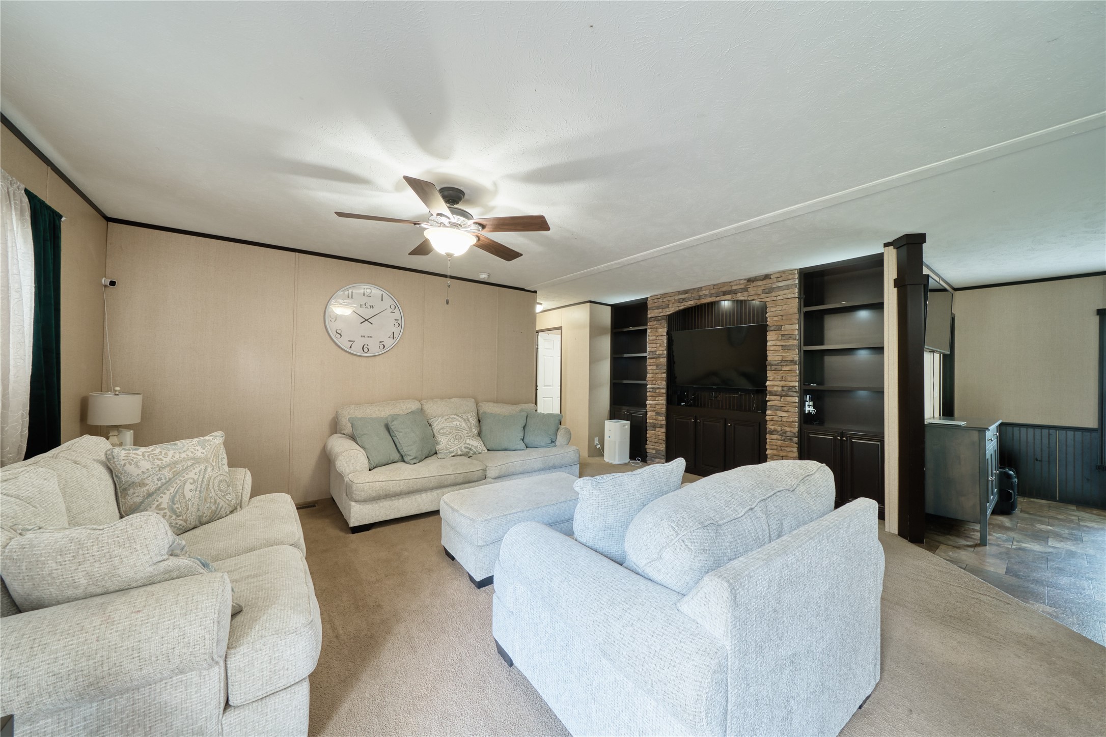 103 County Road 370 Splendora, TX 77372 - Photo 7 of 32 a living room with furniture and a large window