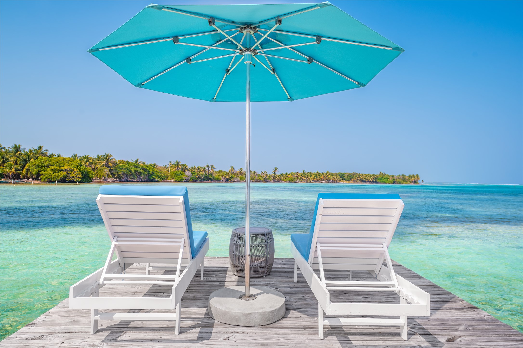 7 Coconut Drive, Unit 9H undefined, undefined 00000 - Photo 4 of 19 a view of a patio with a table and chairs under an umbrella
