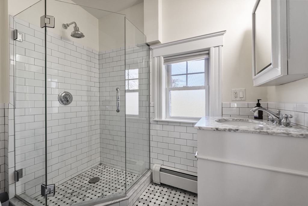 424 Brook Road Milton, MA 02186 - Photo 21 of 41 a bathroom with a sink a toilet and shower