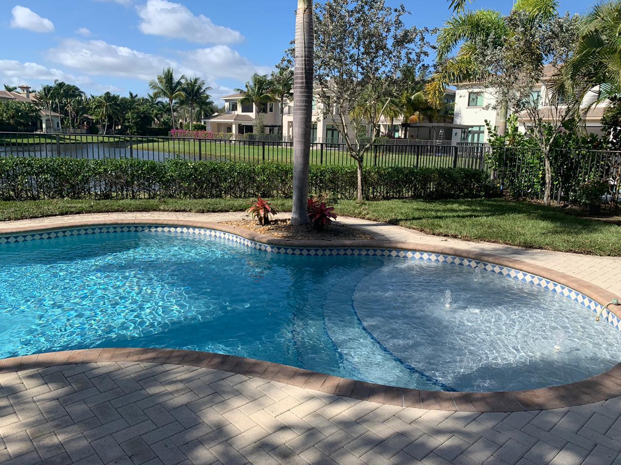 17761 Vecino Way Boca Raton, FL 33496 - Photo 20 of 66 Patio View of Pool and Lake