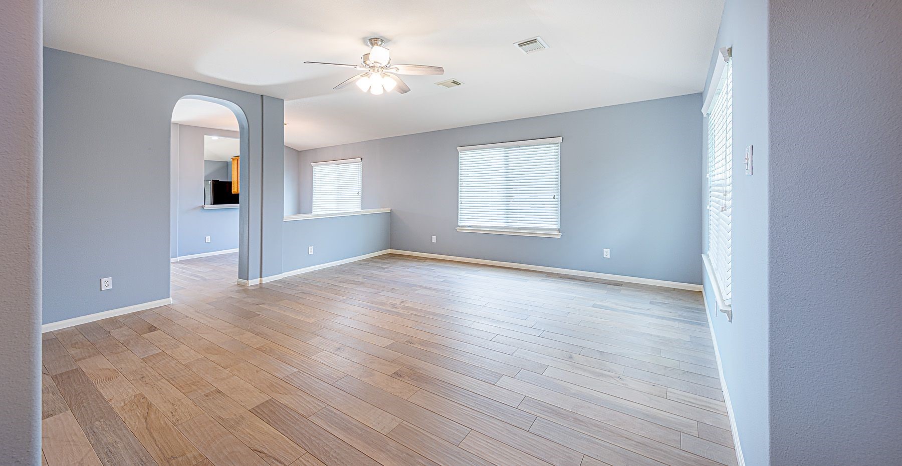 22715 Imperial Ivy Court Spring, TX 77373 - Photo 6 of 33 wooden floor in an empty room with a window