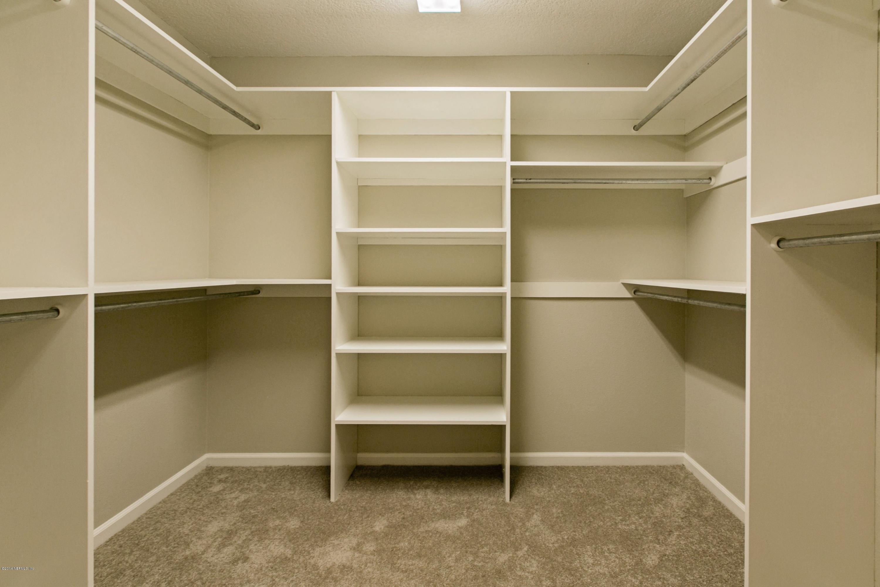 5395 D Church Road St. Augustine, FL 32092 - Photo 17 of 27 a view of walk in closet with empty racks