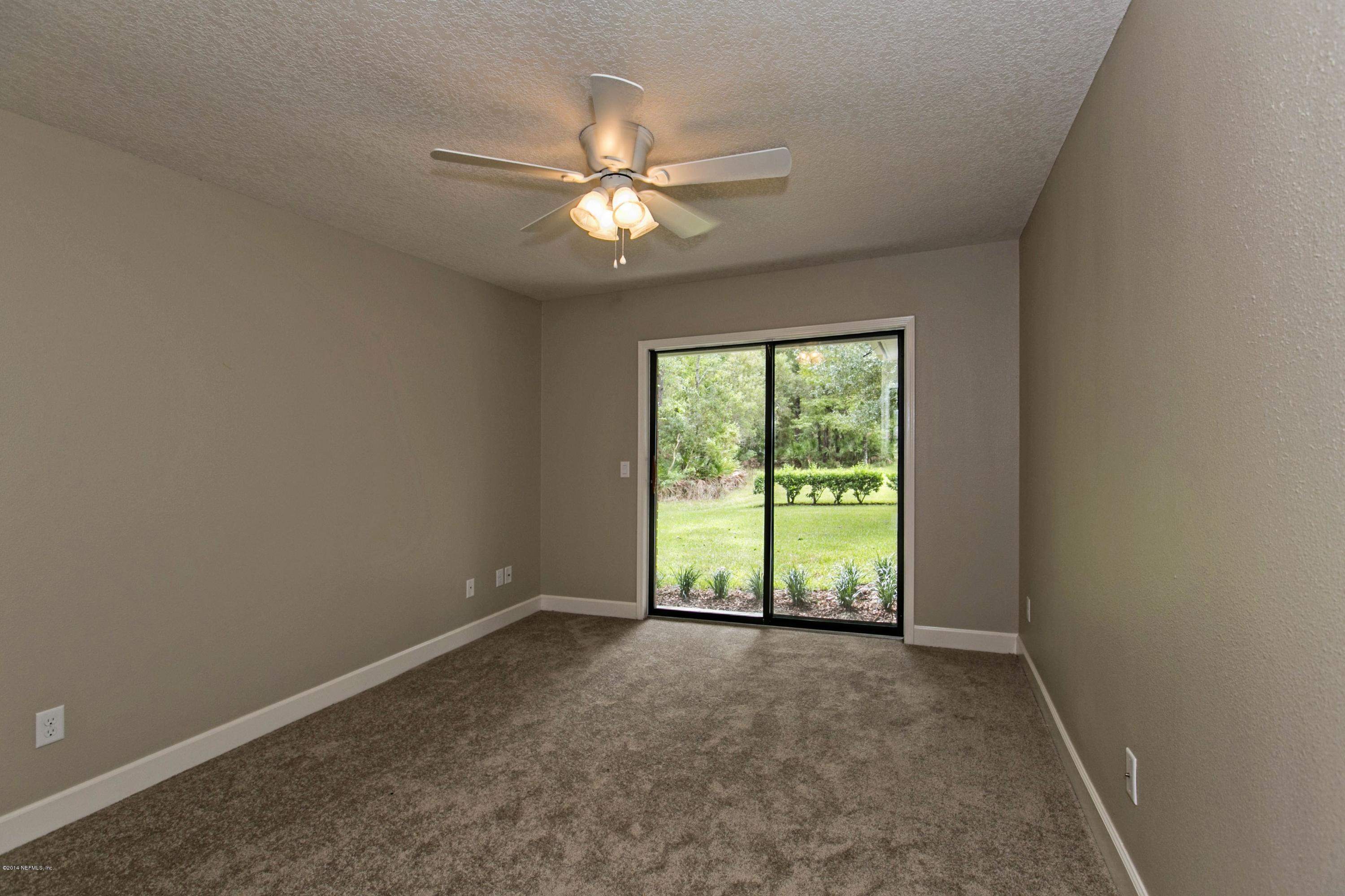 5395 D Church Road St. Augustine, FL 32092 - Photo 18 of 27 a view of an empty room with a window