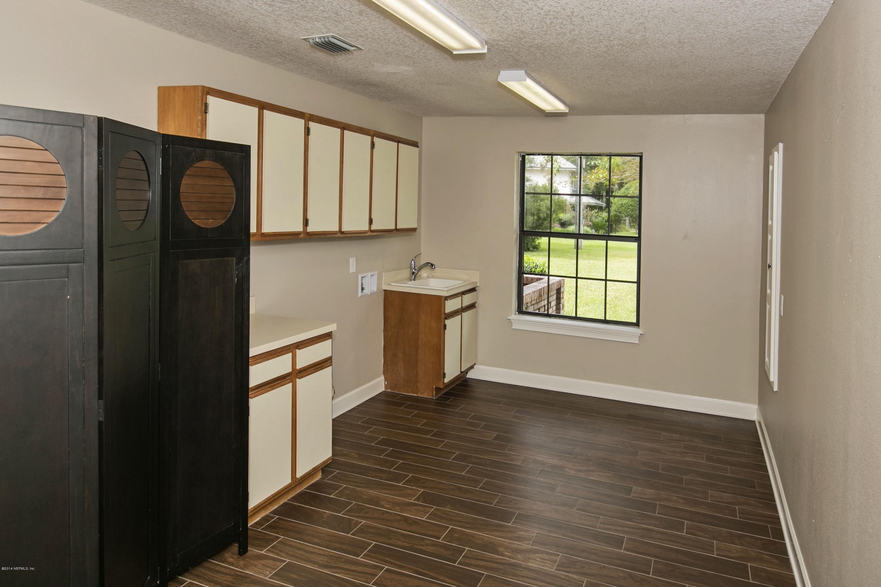 5395 D Church Road St. Augustine, FL 32092 - Photo 21 of 27 a view of a kitchen with wooden floor and electronic appliances