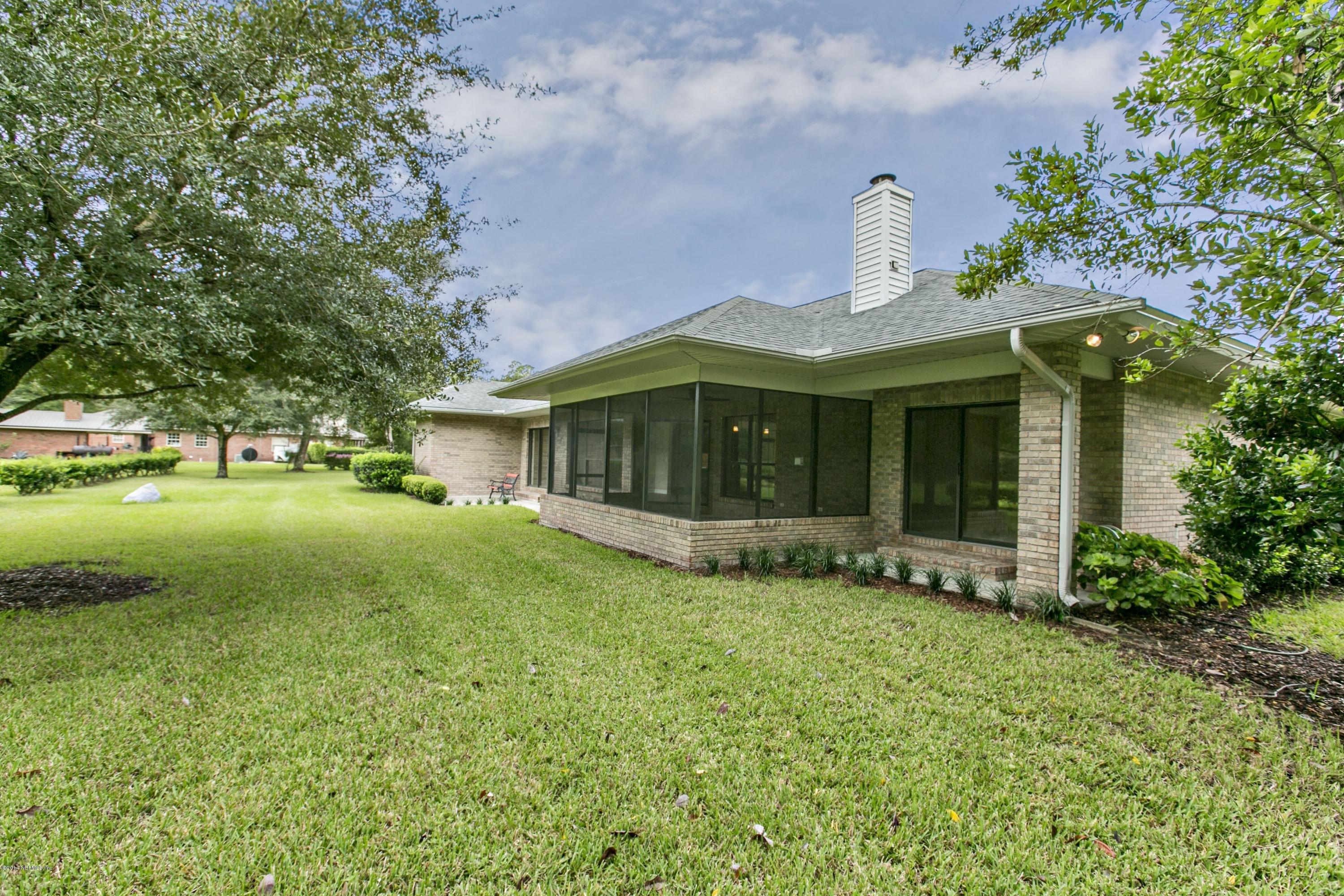 5395 D Church Road St. Augustine, FL 32092 - Photo 23 of 27 a front view of a house with garden