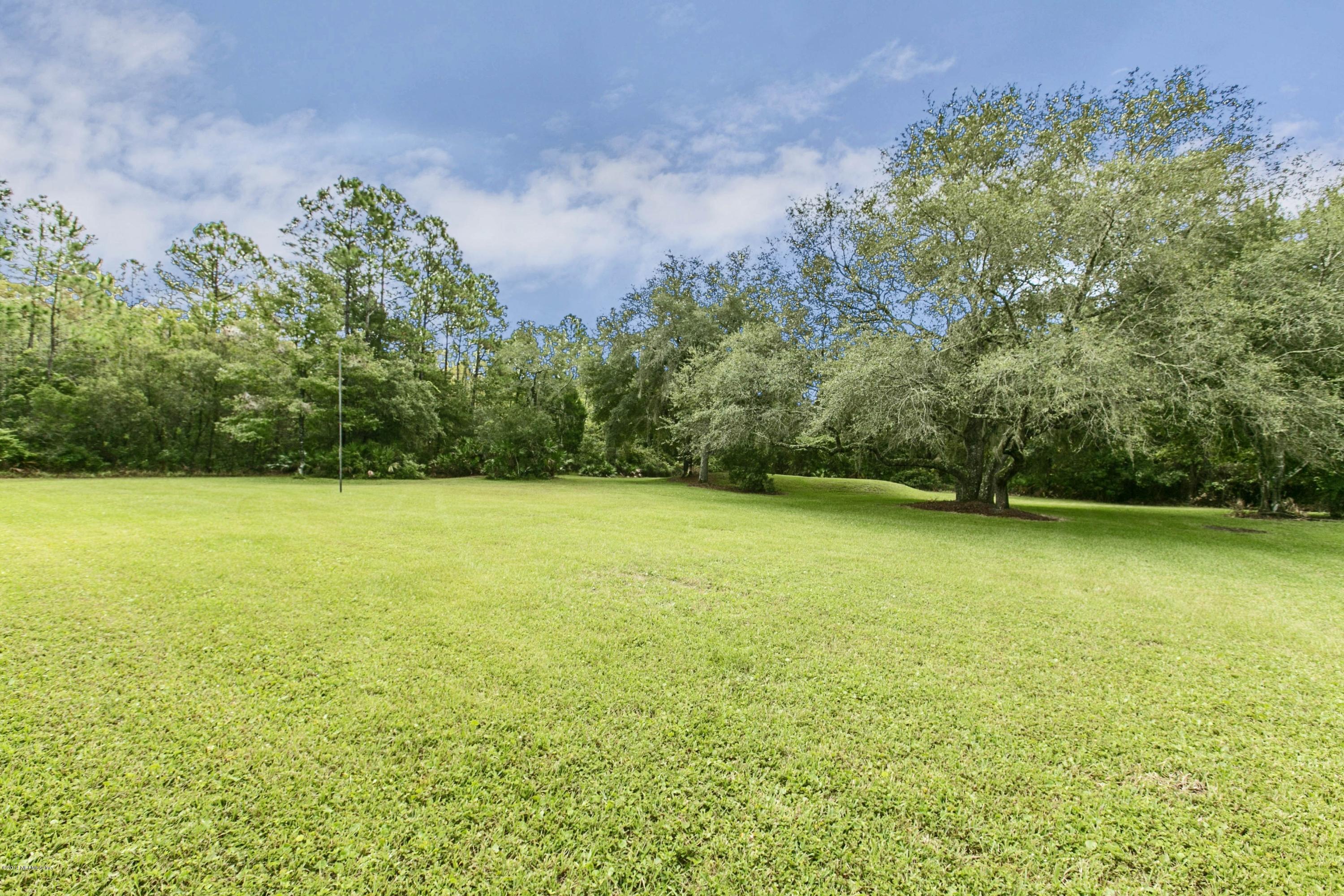 5395 D Church Road St. Augustine, FL 32092 - Photo 24 of 27 a view of a yard with a trees